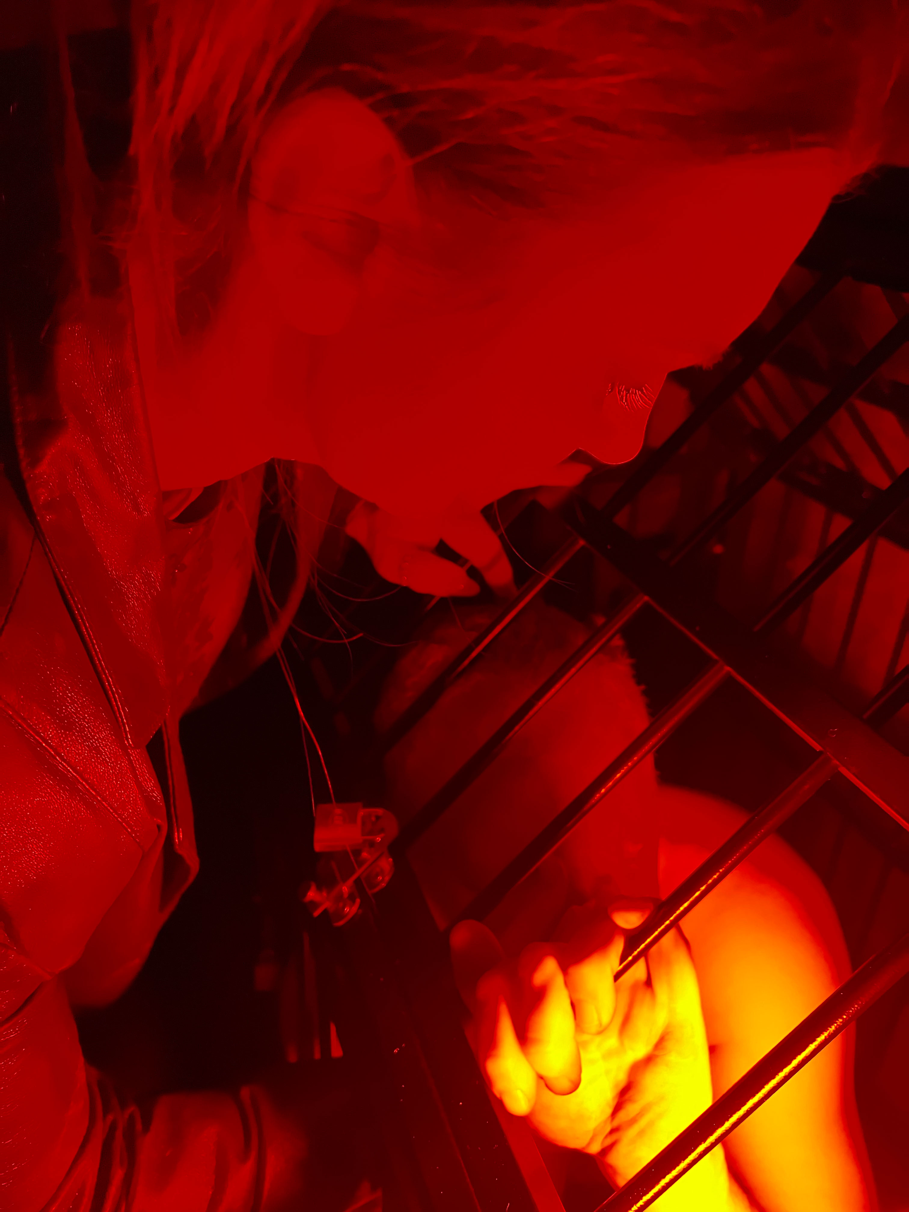 Red-lit cage scene from a previous consensual roleplay experience
